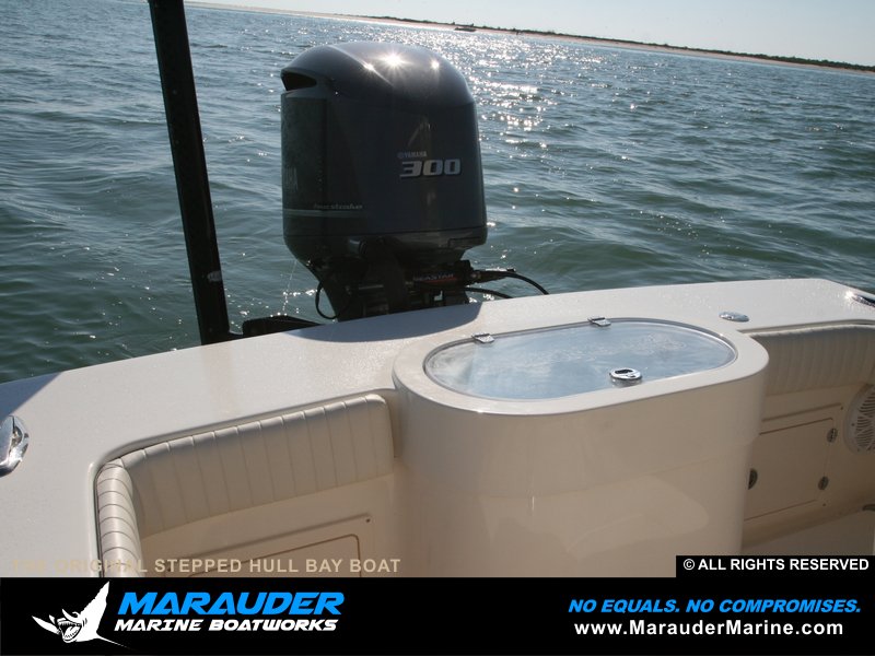 Round sided bait well shown with power pole and skinny water in Stepped Hull Bay Boats photo gallery from Marauder Marine Boat Works
